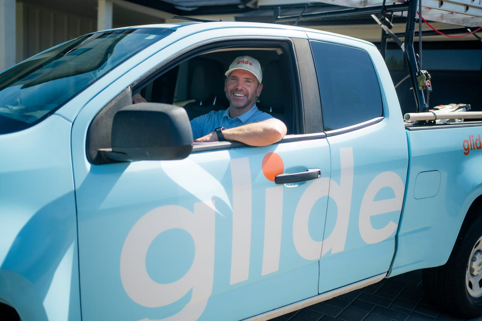 Glide service truck parked outside a home ahead of a scheduled cleaning visit