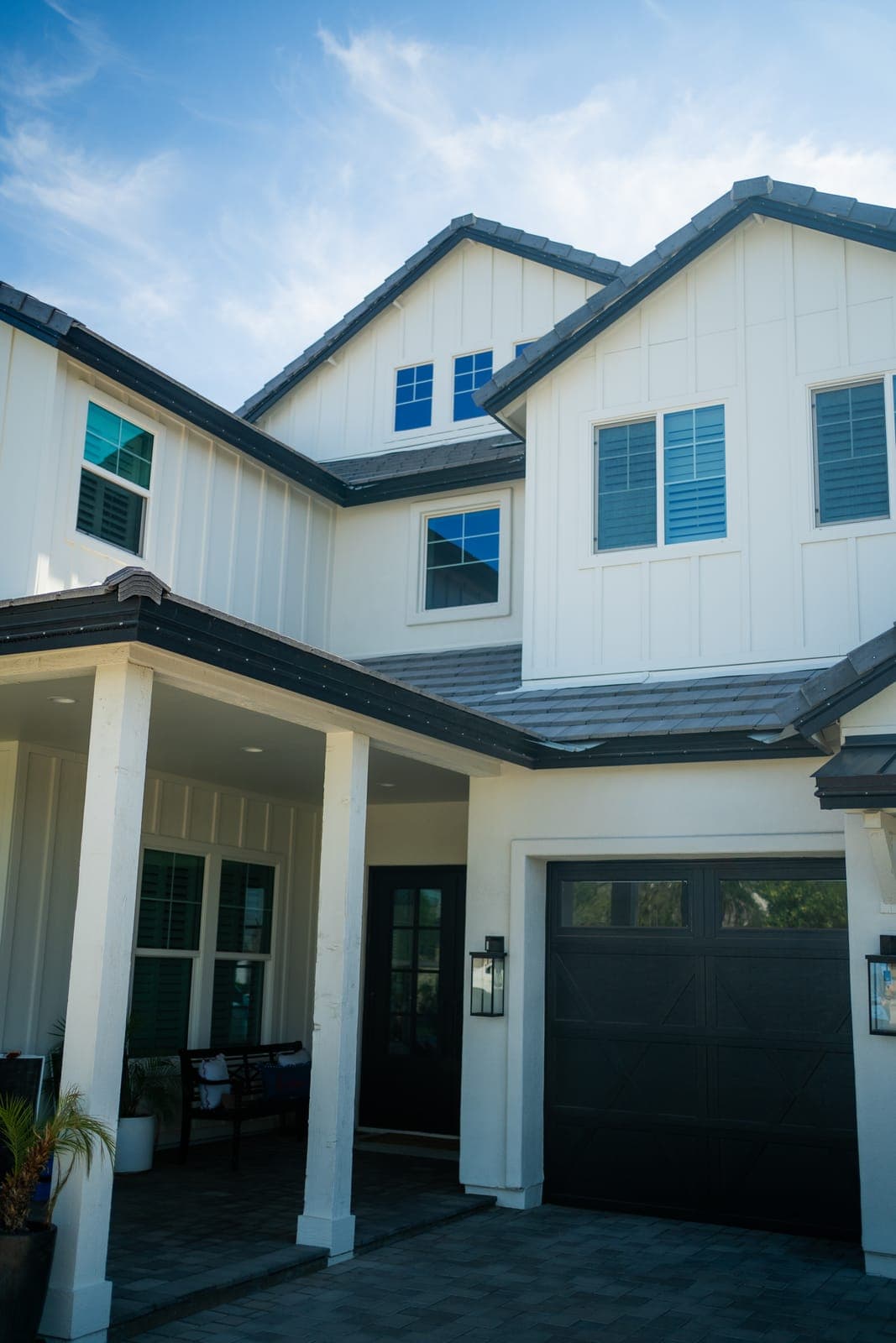 Exterior view of a two-story home's roofline and gutters along the eaves